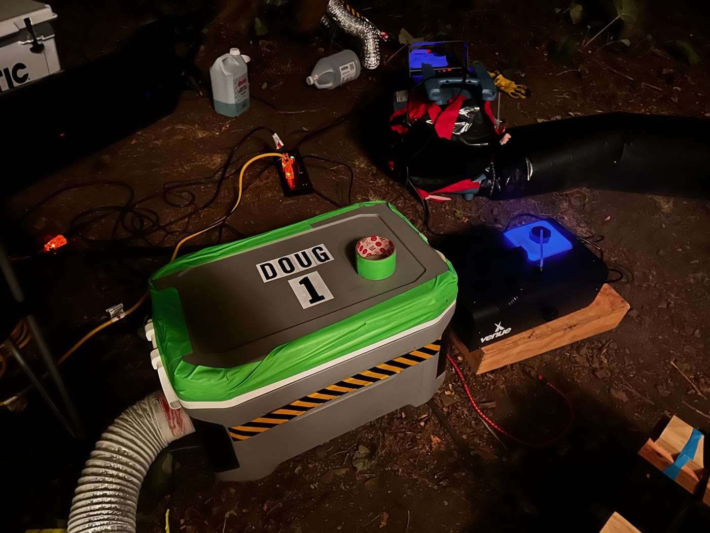The custom dry-ice ground-fog generator DUG beside its fan and ducting.